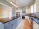 Beautiful kitchen showcasing stainless steel appliances, center island with bar seating, and modern backsplash design at 613 S Mulberry St, Statesville, NC 28677