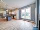 Bright eat-in kitchen featuring stainless steel appliances, large island with bar seating, and abundant natural light at 613 S Mulberry St, Statesville, NC 28677