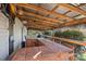 Outdoor seating area on the back deck with a covered tiki bar, perfect for entertaining at 7977 Lucky Creek Ln, Denver, NC 28037