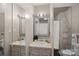Bathroom with vanity, large mirrors, countertop decor and shower with privacy curtain at 7977 Lucky Creek Ln, Denver, NC 28037