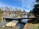 Private dock on the waterfront, perfect for boating and enjoying the tranquil lake views at 7977 Lucky Creek Ln, Denver, NC 28037