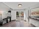 Bright and welcoming foyer with view of the outdoors through open doorway and modern accents at 7977 Lucky Creek Ln, Denver, NC 28037