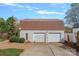 Detached two-car garage with a brown roof, siding, and paved driveway at 7977 Lucky Creek Ln, Denver, NC 28037