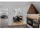 Cozy kitchen with banquette seating, black appliances, and unique wood range hood at 7977 Lucky Creek Ln, Denver, NC 28037