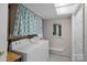 Functional laundry room with a washer, dryer, and utility sink at 7977 Lucky Creek Ln, Denver, NC 28037