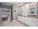 Elegant bathroom with dual sinks, granite countertops, and neutral color scheme at 1005 Antioch Woods Ln, Matthews, NC 28104