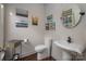 Chic powder room with pedestal sink, decorative mirror, and unique vintage accents at 1005 Antioch Woods Ln, Matthews, NC 28104