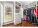 Organized walk-in closet with custom shelving and ample storage space at 1005 Antioch Woods Ln, Matthews, NC 28104