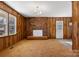 Living room with brick fireplace and wood paneled walls at 1053 Fye Dr, Newton, NC 28658