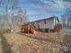 Home exterior showcasing a wooden deck and backyard at 1075 Fye Dr, Newton, NC 28658