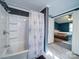 Modern bathroom features a white tub/shower combo and a decorative shower curtain at 1075 Fye Dr, Newton, NC 28658