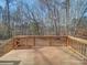 Wooden deck overlooking a wooded backyard at 1075 Fye Dr, Newton, NC 28658