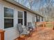 Wooden deck with gray chairs and a small table at 1075 Fye Dr, Newton, NC 28658