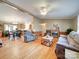 Bright living room with hardwood floors, a fireplace, and comfortable seating with a view to the kitchen and dining area at 1075 Fye Dr, Newton, NC 28658