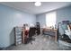 Bright office space with desk, chair, sewing machines, and exercise equipment at 1075 Fye Dr, Newton, NC 28658