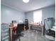 Well-lit home office with a desk, sewing machine, and exercise machine at 1075 Fye Dr, Newton, NC 28658