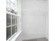Bright walk-in closet with wire shelving and a window, providing natural light and ventilation at 1116 Thayer Glen Ct, Charlotte, NC 28213
