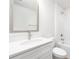 Bathroom with white vanity, modern mirror, bathtub and toilet at 1124 Thayer Glen Ct, Charlotte, NC 28213