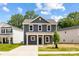 Charming two-story home with gray siding, white trim, a cozy front porch, and inviting curb appeal at 1124 Thayer Glen Ct, Charlotte, NC 28213