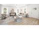 Well-lit living room featuring an open layout, hardwood floors, stylish furnishings, and a welcoming ambiance at 1124 Thayer Glen Ct, Charlotte, NC 28213