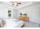 Spacious main bedroom with tray ceiling, ceiling fan, and bright natural light at 1124 Thayer Glen Ct, Charlotte, NC 28213
