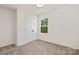 This bedroom is awash in natural light and features a double-door closet and soft carpeting at 1132 Thayer Glen Ct, Charlotte, NC 28213