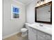 Clean bathroom with updated vanity and tile flooring at 11430 Gelding Dr, Charlotte, NC 28215