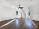 Large bedroom with hardwood floors and ceiling fan at 11430 Gelding Dr, Charlotte, NC 28215