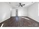 Large bedroom with hardwood floors and access to bathroom at 11430 Gelding Dr, Charlotte, NC 28215