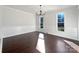 Bright dining room with hardwood floors and wainscoting at 11430 Gelding Dr, Charlotte, NC 28215