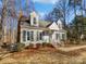Charming ranch home with gray siding, white trim, and landscaping at 11430 Gelding Dr, Charlotte, NC 28215