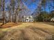 Charming house with landscaped yard and tree-lined street at 11430 Gelding Dr, Charlotte, NC 28215