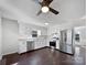 Renovated kitchen with stainless steel appliances and dark hardwood floors at 11430 Gelding Dr, Charlotte, NC 28215
