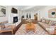Virtually staged living room with fireplace and hardwood floors at 11430 Gelding Dr, Charlotte, NC 28215