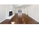 Bright living room featuring hardwood floors and fireplace at 11430 Gelding Dr, Charlotte, NC 28215