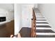 Elegant wooden staircase leading to the upper level at 11430 Gelding Dr, Charlotte, NC 28215