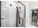 This bright bathroom features a glass shower with matte black hardware at 115 Verbena Ne St # 12, Charlotte, NC 28217