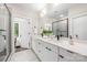 Contemporary bathroom featuring double vanity, modern faucets, and a glass door shower at 115 Verbena Ne St # 12, Charlotte, NC 28217