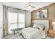 This calming bedroom features soft neutral colors, decor accents, and a ceiling fan at 115 Verbena Ne St # 12, Charlotte, NC 28217