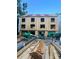 Construction site displaying the exterior framing of a new three-story townhouse complex at 115 Verbena Ne St # 12, Charlotte, NC 28217