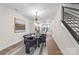 Dining room featuring a decorative light fixture and a modern staircase at 115 Verbena Ne St # 12, Charlotte, NC 28217
