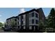 Chic townhomes featuring modern design, lush landscaping, and private parking spaces at 115 Verbena Ne St # 12, Charlotte, NC 28217