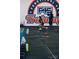 Interior view of fitness center with workout equipment and F45 Training logo on the wall at 115 Verbena Ne St # 12, Charlotte, NC 28217