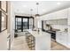Modern kitchen featuring a waterfall island with bar stool seating, and stainless steel appliances at 115 Verbena Ne St # 12, Charlotte, NC 28217