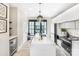 Bright kitchen with a large island, modern pendant lighting, and high-end stainless steel appliances at 115 Verbena Ne St # 12, Charlotte, NC 28217