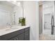 Modern bathroom with gray vanity and shower at 13109 Brooklyn Skylar Way, Huntersville, NC 28078