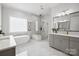 Luxurious bathroom with double vanity, soaking tub, and marble shower at 13109 Brooklyn Skylar Way, Huntersville, NC 28078