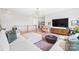 Bright bonus room with sectional sofa and window views at 13109 Brooklyn Skylar Way, Huntersville, NC 28078