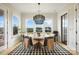 Breakfast room with round table, wood flooring, and view of backyard at 13109 Brooklyn Skylar Way, Huntersville, NC 28078