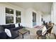 Relaxing front porch with comfortable seating at 13109 Brooklyn Skylar Way, Huntersville, NC 28078
